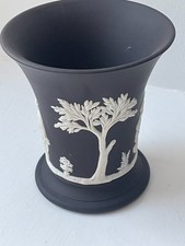 Wedgwood black basalt jasperware flared trumpet vase with white bas-reliefs.