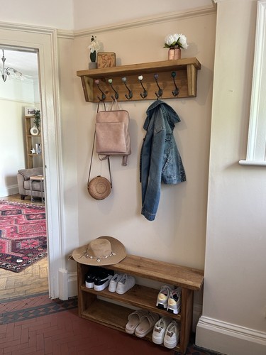 Floating wooden coat - rack, and