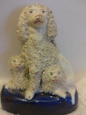 Antique Staffordshire confetti poodle with pups on cobalt base