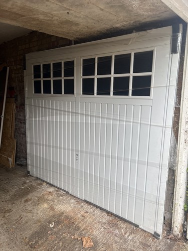 White and over garage door - up,