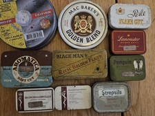 Empty pipe tobacco tin cans
