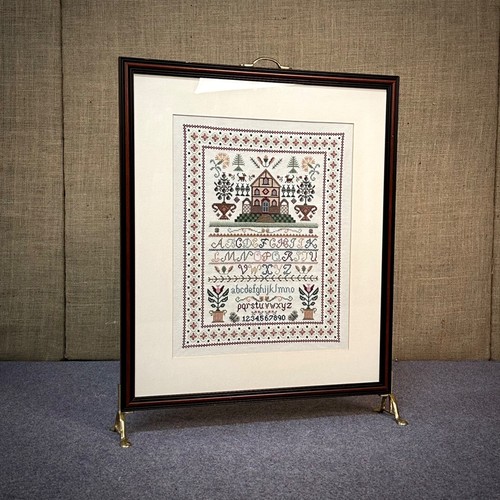 Attractive framed sampler fire - sampler,