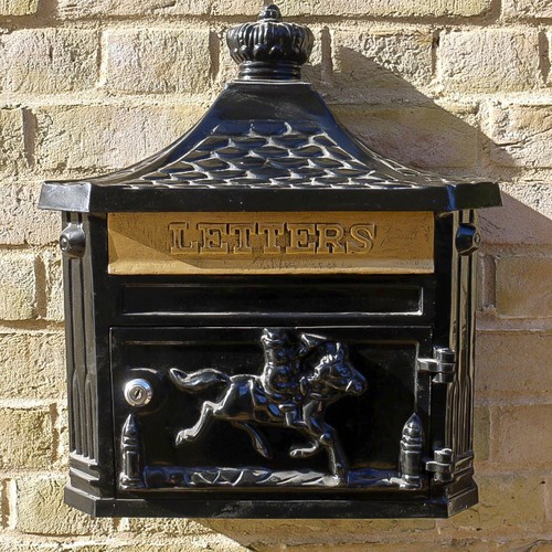Black wall mounted letter - wall,