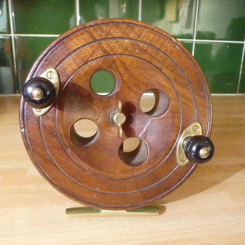 Old wooden fishing reel - wooden,