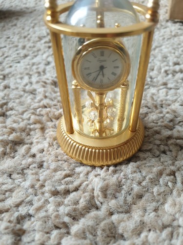 Miniature clock glass - in, a