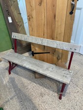 Late Victorian compact red cast iron bench