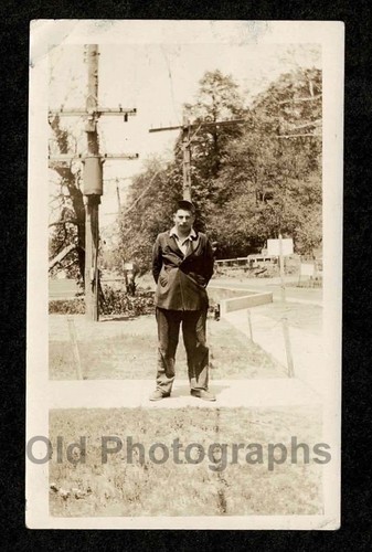 Tough young man hands behind - man,