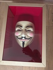 V for Vendetta face mask in a