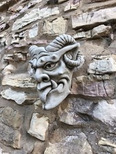 Devil gargoyle face wall