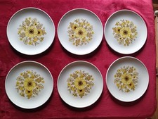 12 plates Hostess Tableware