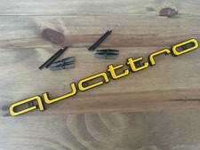 Yellow And Black Quattro Badge