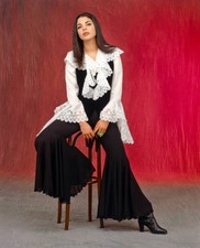 Italian actress singer Mietta sitting on a stool wearing a white s- Old Photo