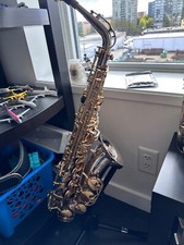 Silver and gold alto saxophone