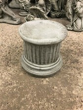 Small concrete stone plinth