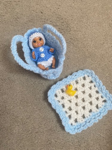 Hand knitted dolls clothes