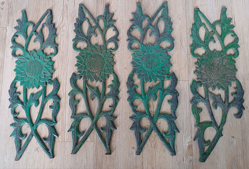 Four 1930s cast iron sunflower