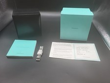 TIFFANY & CO RESONATOR -  DIAMOND BEZEL WHITE DIAL QUARTZ WATCH.