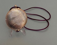 Sensuous Estée Lauder Touch-On solid perfume compact necklace from 2009