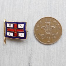 A RNLI Royal National Lifeboat Institution enamel 'flag' badge - maker WO Lewis