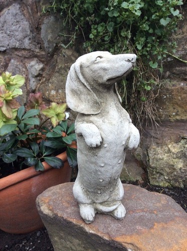 Stone garden dachshund sausage