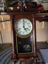 A LINCOLN 31 DAY PENDULEM WALL CLOCK CASED MAHOGONEY FINISH WITH PENDULEM &KEY