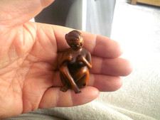 Hand Carved wood netsuke of a