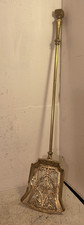 A vintage brass fire coal shovel