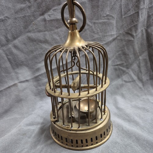 Vintage brass bird - in, birdcage