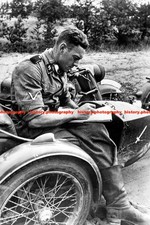 F016592 SS soldier Sits on the Motorcycle WW2