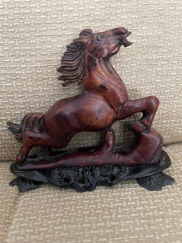 Brown carved wooden rearing
