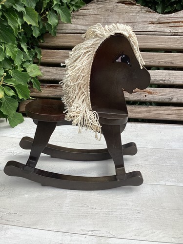 One wooden rocking horse - rocking,
