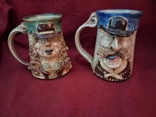2 John Coiner Face Mugs