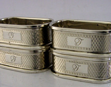 FOUR ENGLISH SOLID STERLING SILVER ENGINE TURNED NAPKIN RINGS 1959/60