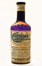 ANTIQUE DEEP AMETHYST (IRRIDIATED) LABELED / EMBOSSED NEWBRO'S HERPICIDE BOTTLE