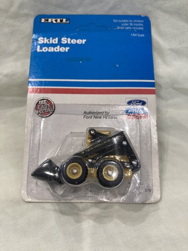 Ertl ford new holland skid - new,