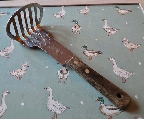 Vintage stainless steel masher - steel,
