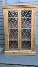 Solid pine leaded glazed bookcase.