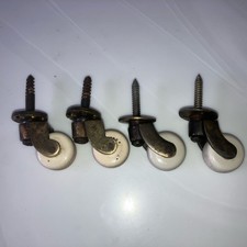 SET OF 4 VICTORIAN ANTIQUE BRASS AND PORCELAIN CERAMIC  FURNITURE CASTORS