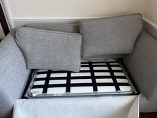 Two Gray Sofas One Pull Out