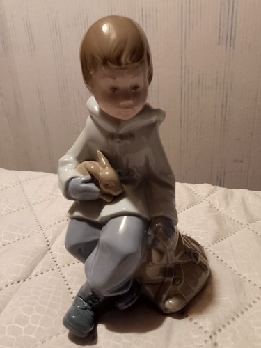 Nao boy sat rock - nao, a