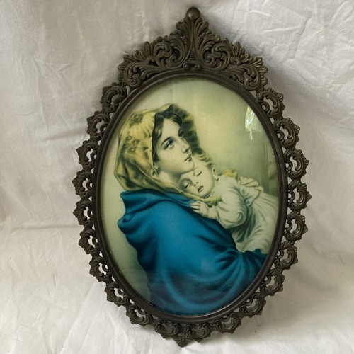 Oval cast metal madonna - madonna, and