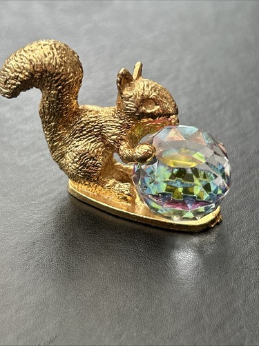 Gold coloured squirrel - gold,