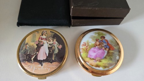 Two old powder compacts - two,