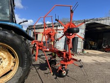 Kuhn 4 Rotor Tedder. Tractor