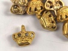 Solid crown as pad for shoulder pieces, width 23 mm, non-ferrous metal gold plated.