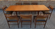MCINTOSH EXTENDING DINING TABLE & EIGHT CHAIRS IN TEAK