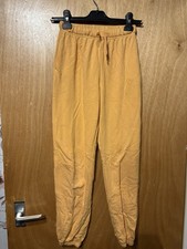 Kids orange joggers from H&M