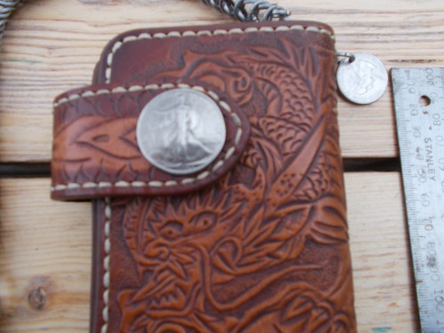 Tan carved leather wallet and - leather,