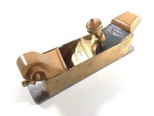 NIGHTINGALE SKEW MOUTH MITRE PLANE SCROLLED FRONT BUN.