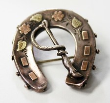 Victorian Silver horseshoe brooch with rose and yellow gold overlay. Birmingham 